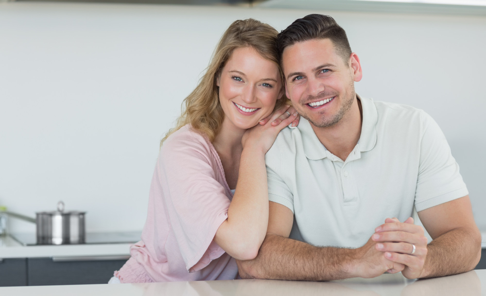 couple-smiling-kitchen-counter